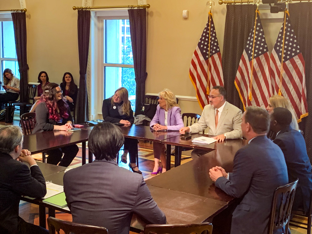 Image of Theresann Pyrett at a conference table with education leaders in Washington, D.C.