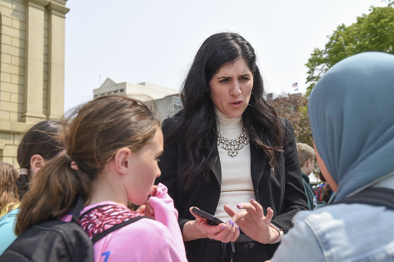 Students visit their former teacher, State Representative Jaime Churches, outside the Michigan Capitol.