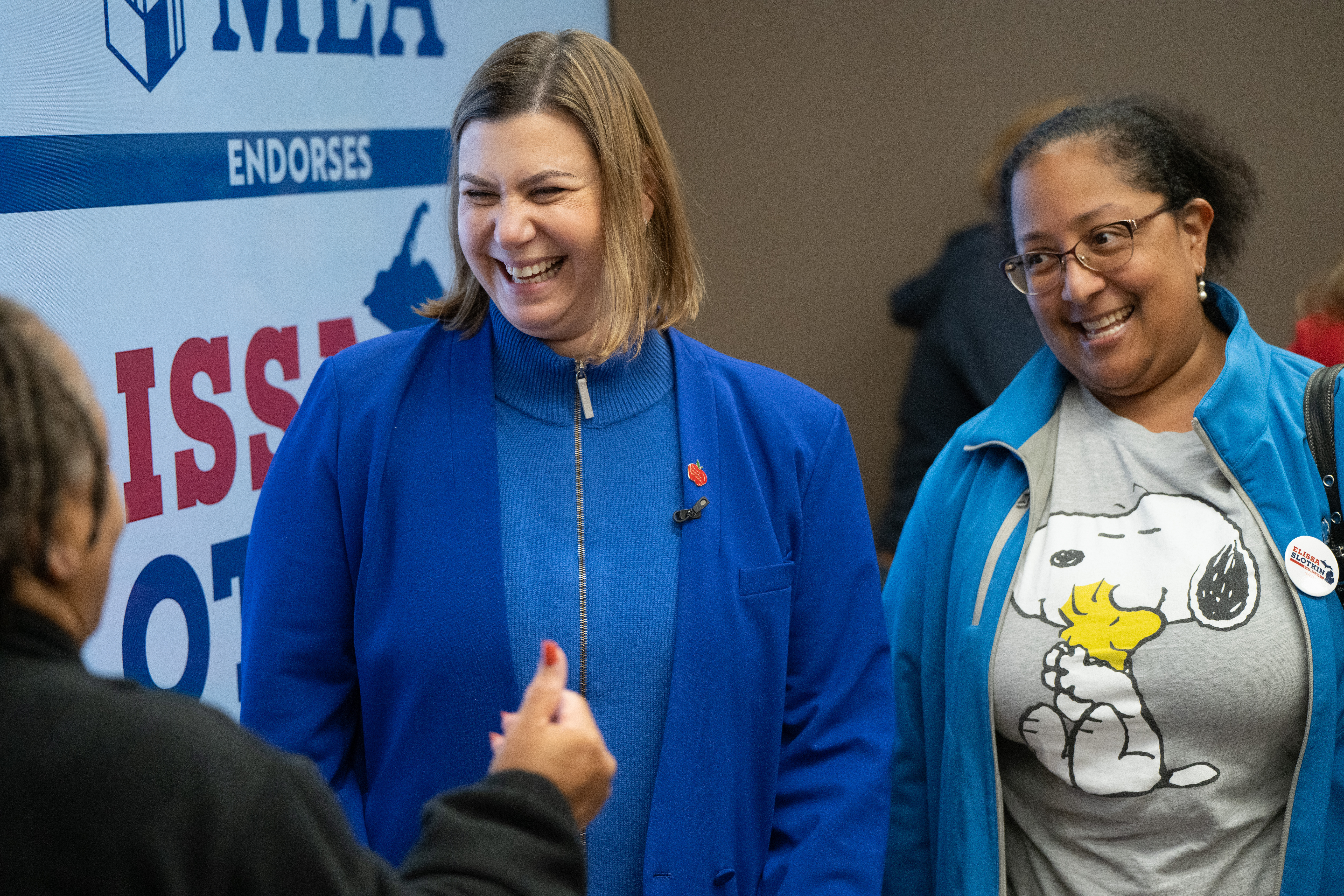 A picture of Elissa Slotkin smiling with a supporter.