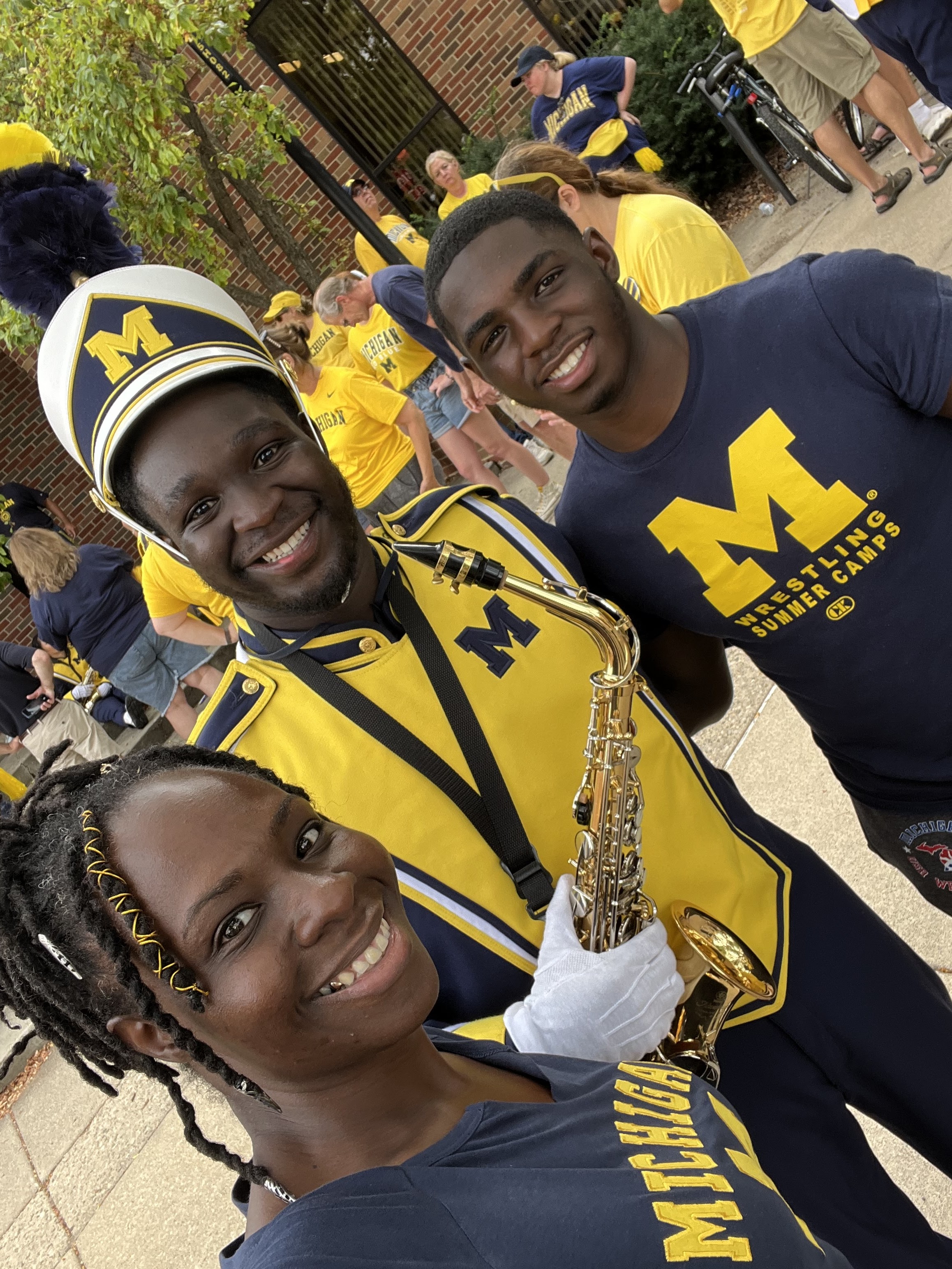 A picture of Arshen Baldwin and her two sons at a University of Michigan game.