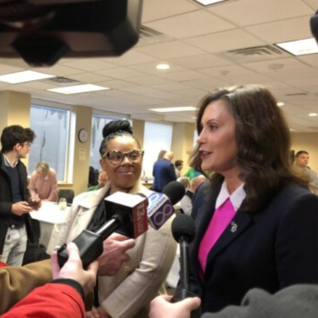 A picture of Governor Gretchen Whitmer responding to reporters.