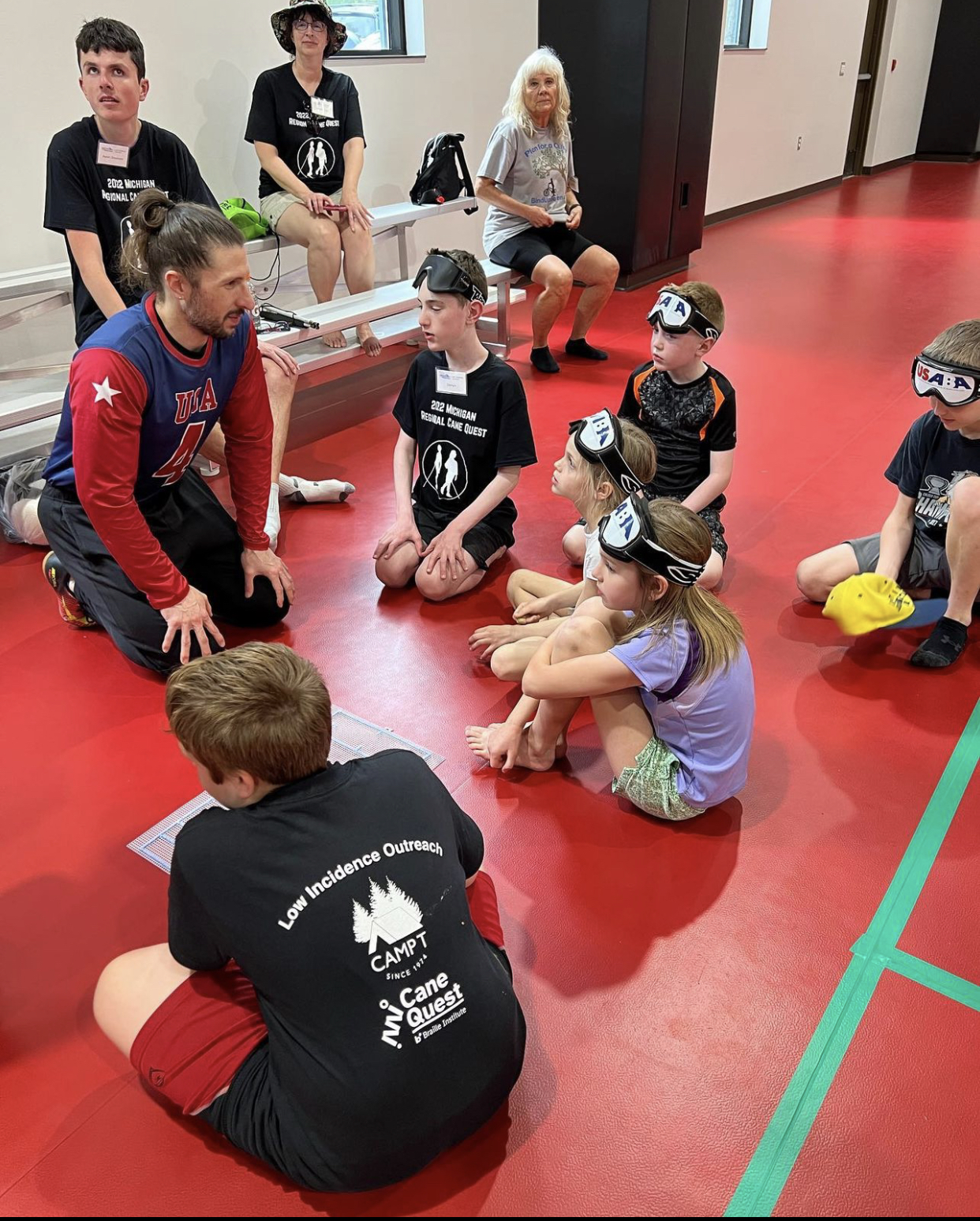 Kusku is paying it forward by coaching a goalball team of young athletes. 