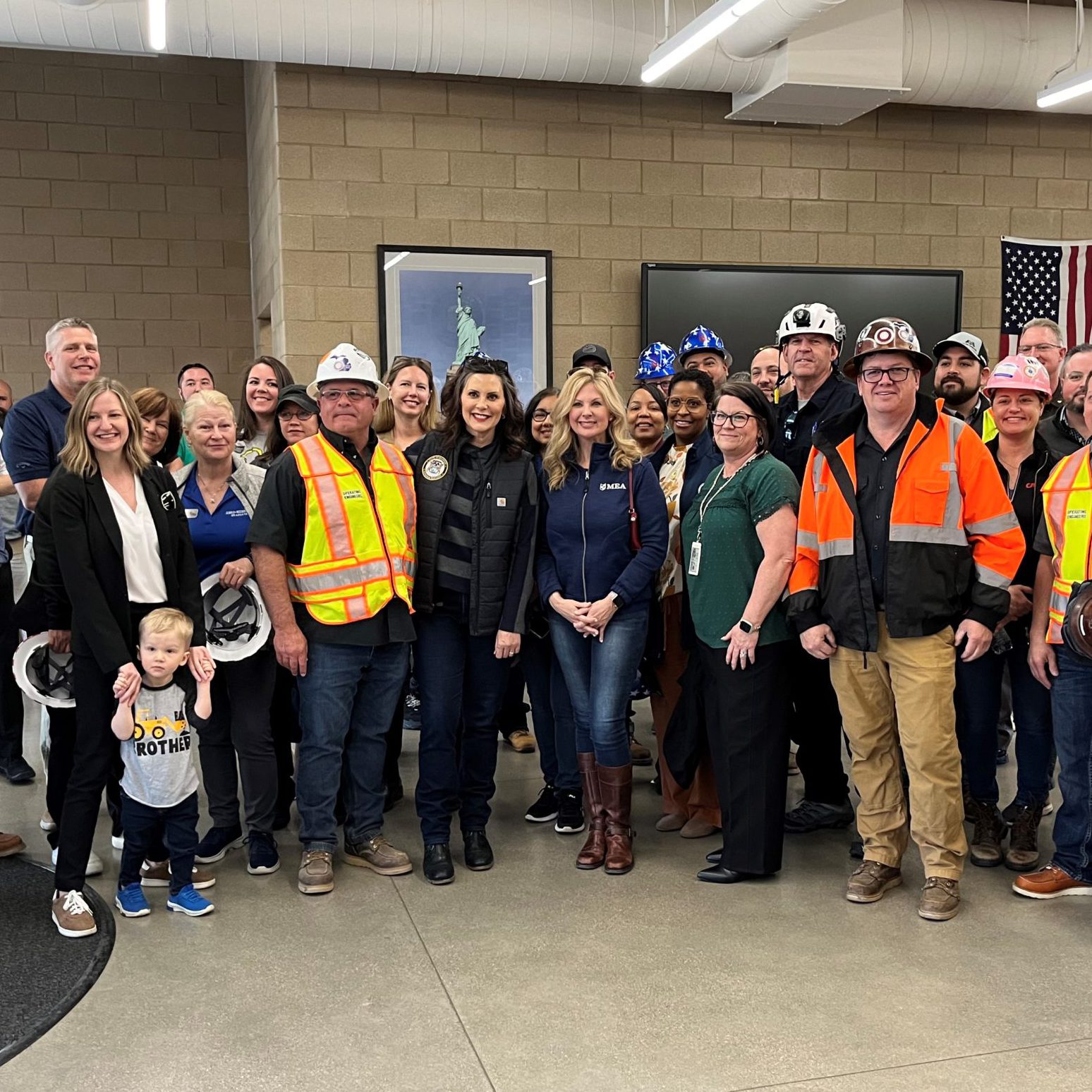 A group photo featuring Governor Whitmer and MEA President Madafferi