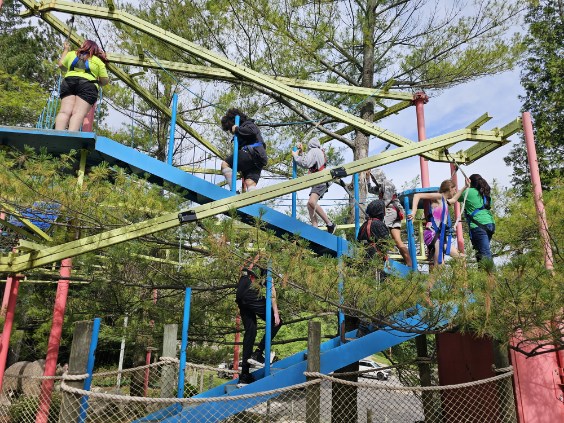 A photo of students on an obstacle course